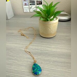 Elegant Gold Necklace with Blue Pendant